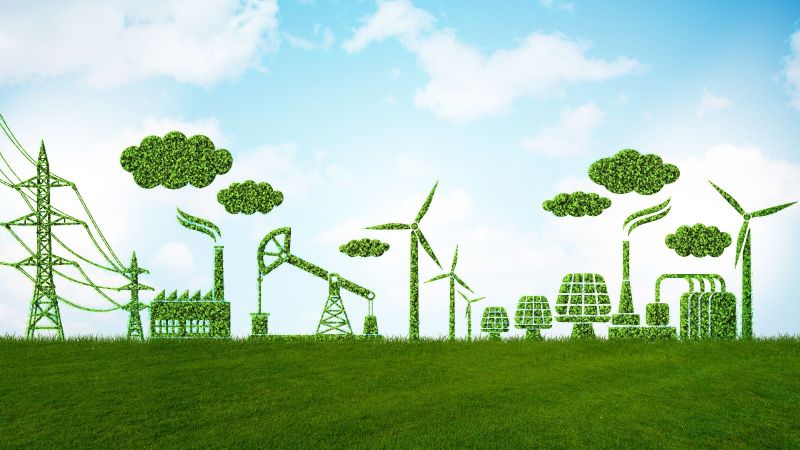 Das Bild zeigt eine symbolhafte Darstellung von Industrie, die aus Grün besteht, um zu signalisieren, dass sie klimaschonend funktioniert.